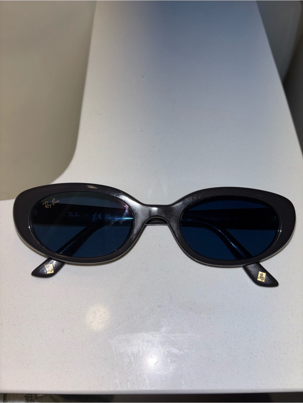 Ray-Ban Women's Year of the Horse Oval Black Frame Sunglasses with Blue Lenses